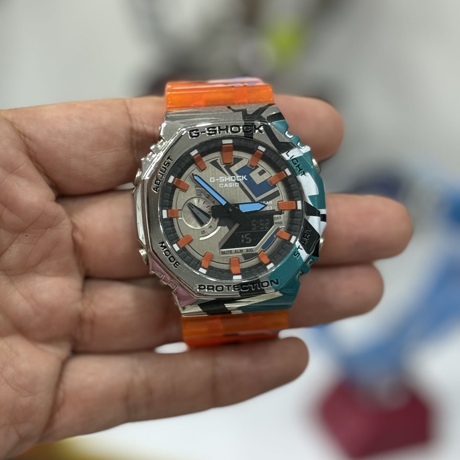 کاستوم ساعت جی‌شاک GA-2100 CasiOak | بزل طرح‌دار تیل + بند شفاف نارنجی | مدل خاص و محدود